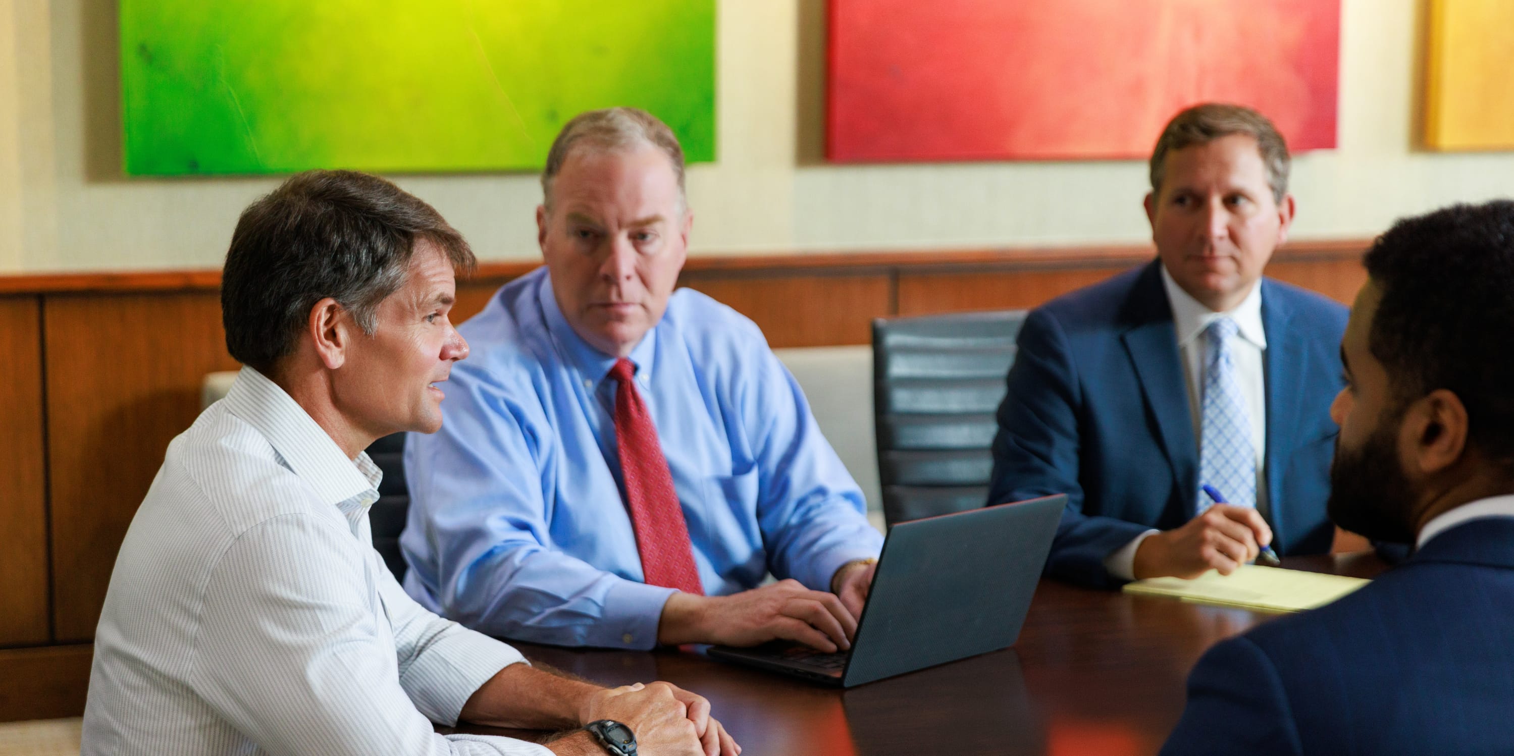 Taylor Porter attorneys sitting around a conference table